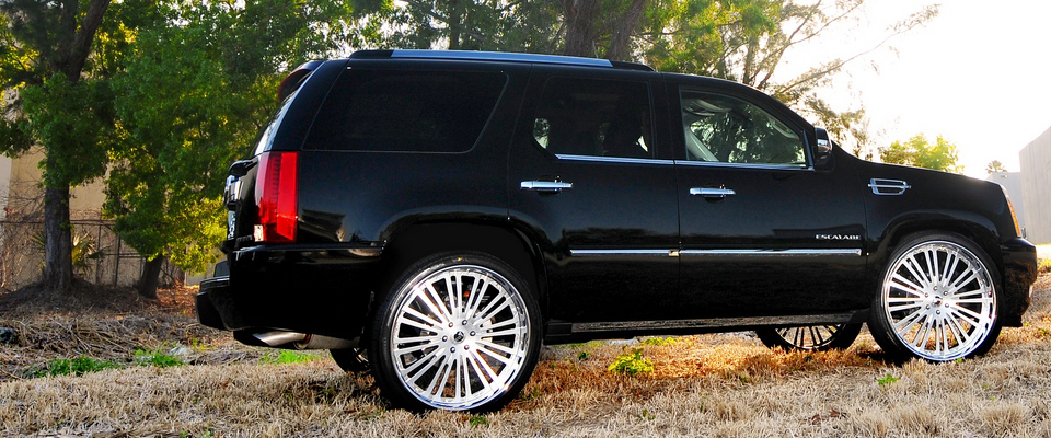 Cadillac Escalade on 24" Valhalla w/ brushed blue light tinted centers
