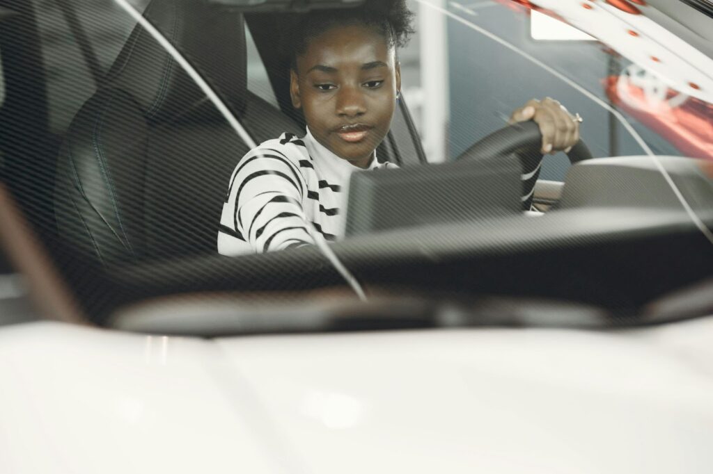 woman seated in car